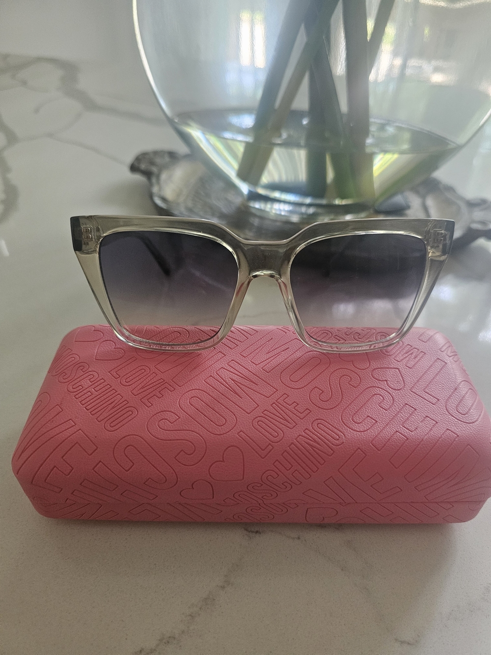 Love Moschino Clear Frame Sunglasses with Gradient Gray Lenses and Pink Case
